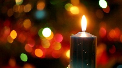 stock-footage-christmas-candle-against-s