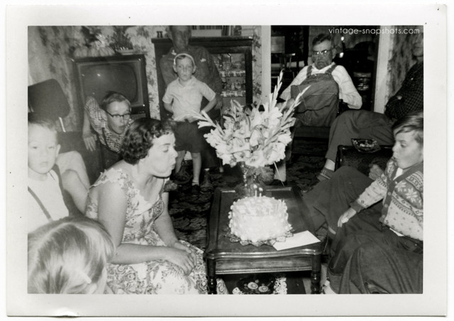 family-blowing-out-candles-1950s.jpg