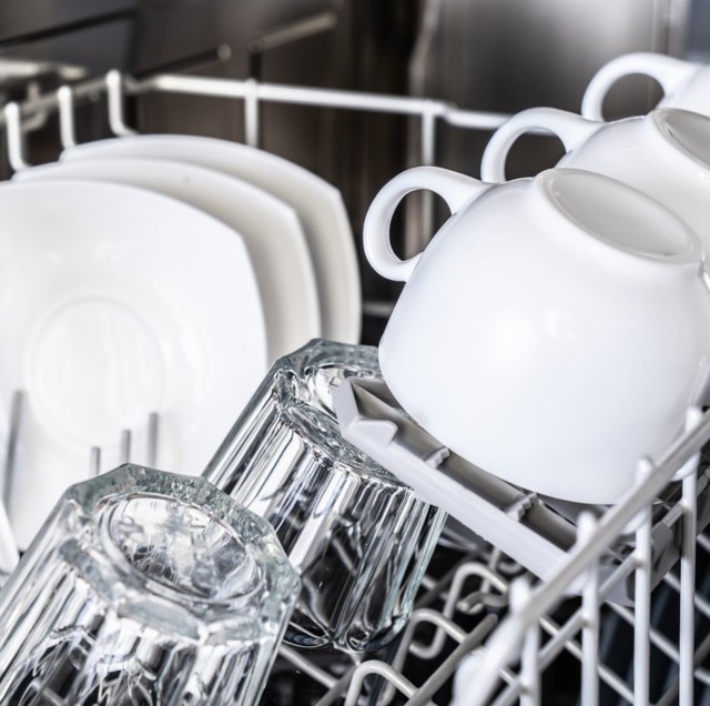 white-cups-in-new-dishwasher-royalty-fre